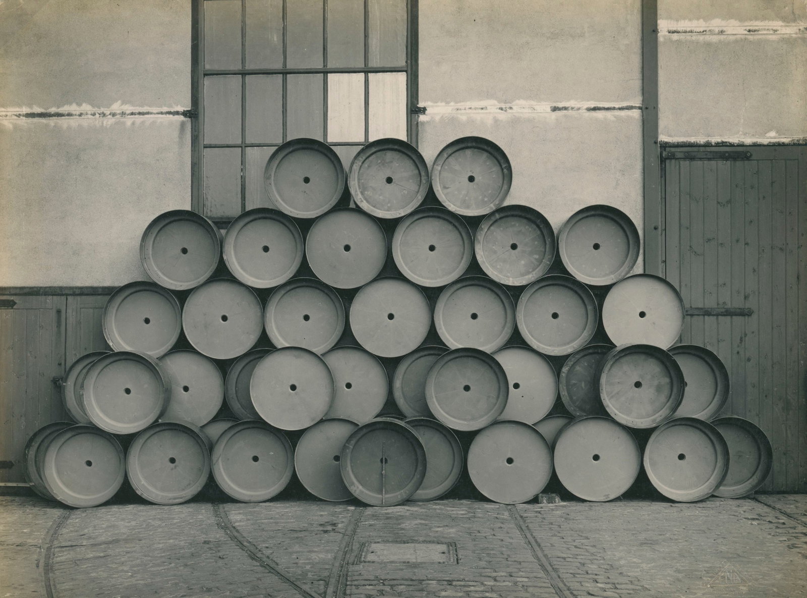 ABSTRACT. Reels. C1930: Interesting industrial image of stacked reels. Very good contrast and tonality. Photographer: F.N. Birkett. 9.5 x 11.375 in.