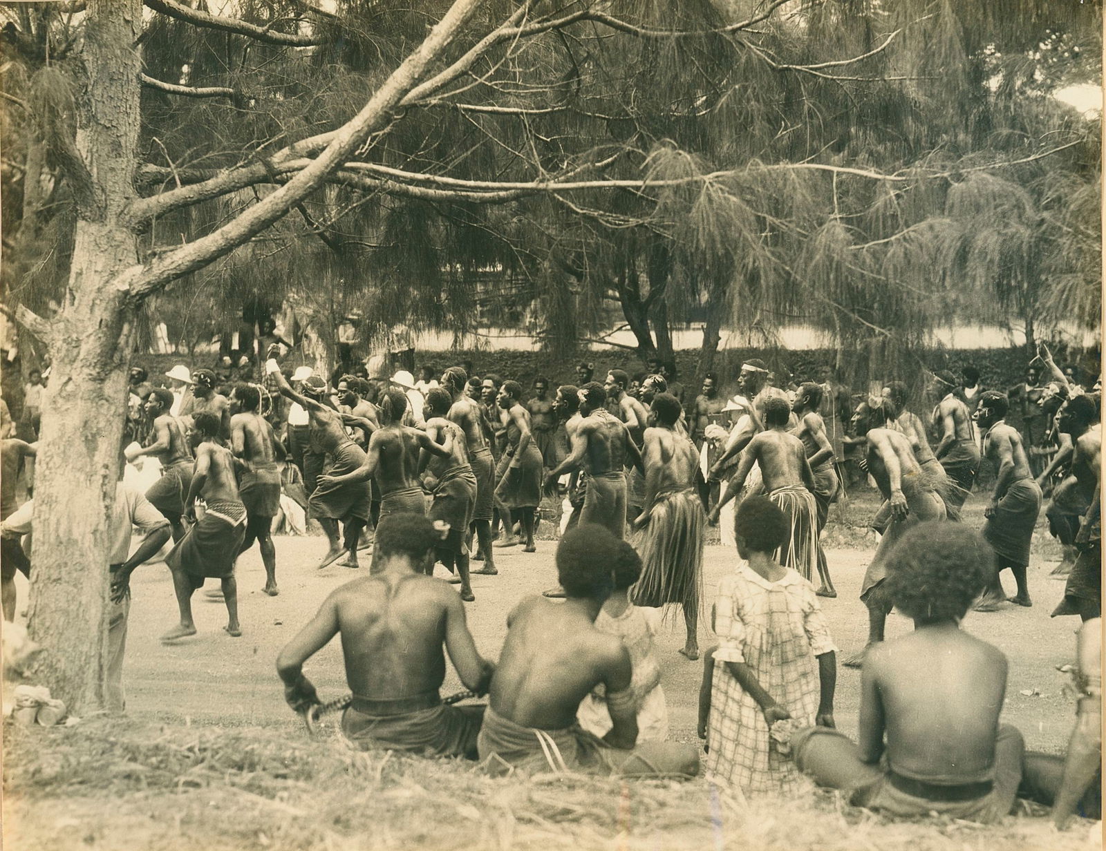 Native Dancing, Port Moresby, New Guniea. c1925: Native Dancing, Port Moresby, New Guniea. c1925. By Ewing Galloway Agency. Very good contrast and tonality. 7.5 x 9.5 in.