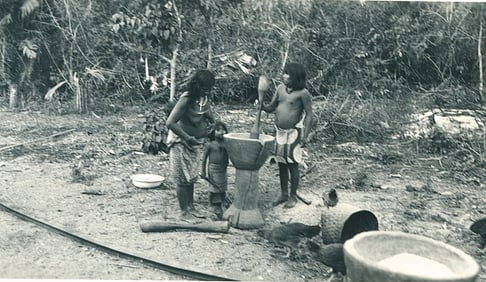 Darien Indians pounding corn. Panama. c1940
