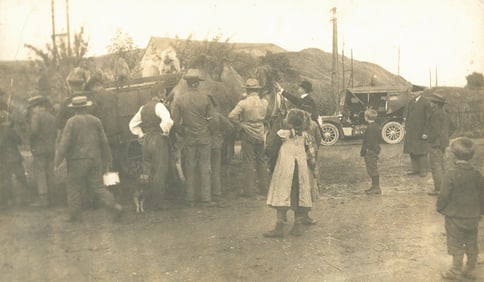 Group attracted to Monkeys and a Camel. c1920