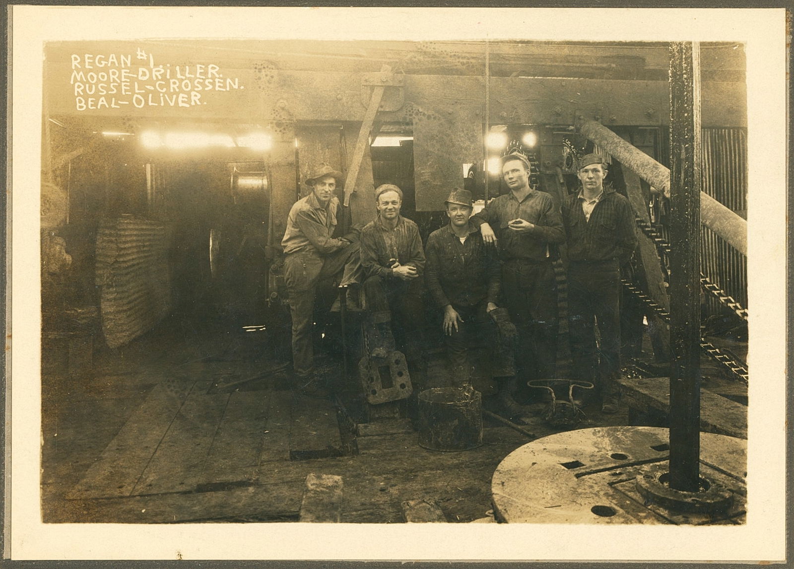 Oil Drilling Crew. c1920: Oil Drilling Crew. C1920. Regan #1. Crew: Moore,driller, Grossen, Russell, Beal & Oliver.Good contrast and tonality. 4.375 x 6.25 in.