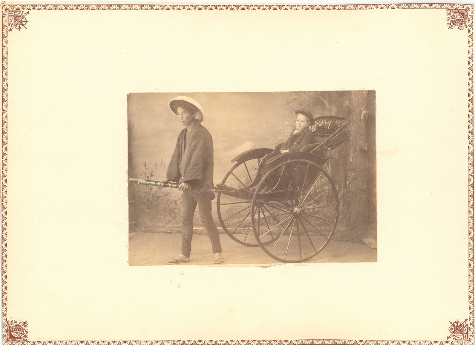 JAPAN. Album Sheet with Boy in a Rickshaw. C1890.: Album Sheet with Boy in a Rickshaw. C1890. Reverse side with 4 photographs of Japan. Av 3.25 x 5 in. each. Sheet 8 x 11 in.
