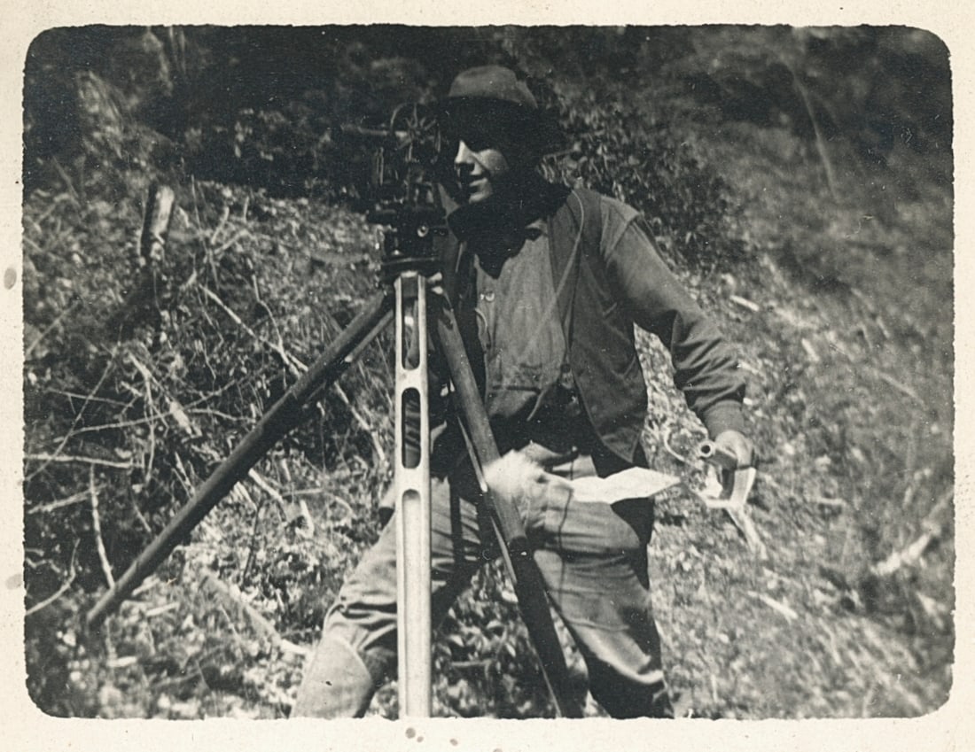 RPPC of a Surveyor with Theodolite. c1920: RPPC of a Surveyor with Theodolite. C1920. Image size: 2 x 2.625 in on PC 5.375 x 3 .375 in
