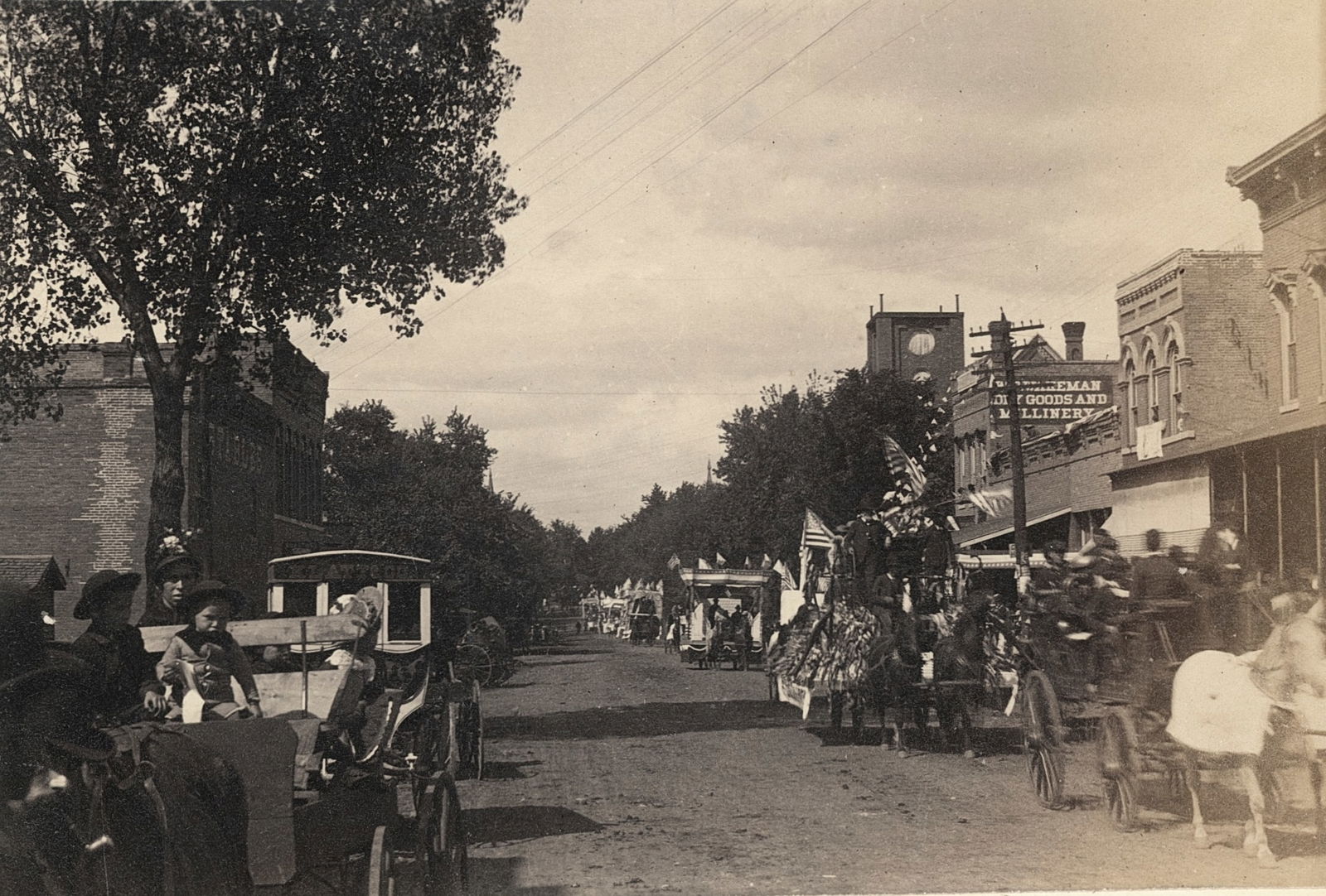 Beatrice, Nebraska. Fourth of July Parade. C1910.: Beatrice, Nebraska. Fourth of July Parade. C1910. 3.75 x 5.625 in. Reverse: View of Cliff from Belmonts, Newport, R.I. 3.5 x 5.5 in.