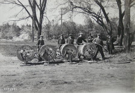 Industrial Photograph Album - Installation of telegraph: Interesting group of 12 photographs of the installation of new telegraph poles and wires in Manchester, NH. Street names in captions in the negatives. Album size 7.1 x 10.25 inches, 18 x 26 cm (front