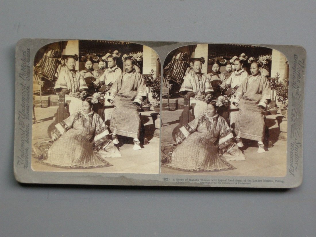 Stereo view of a group of Manchu Women. C1901: Stereo view of a Group of Manchu Women with typical head-dress, of the London Mission, Peking, China. 1901 by Underwood & Underwood.