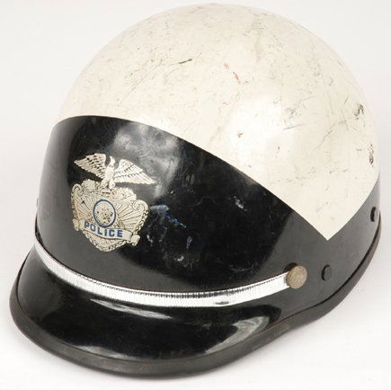 Robert Blake Police Helmet Electra Glide in Blue: An instantly recognizable prop from a cult classic, offered here is Robert Blake's police style motorcycle helmet from the 1973 film "Electra Glide in Blue". Helmet exhibits moderate scuffing on the o