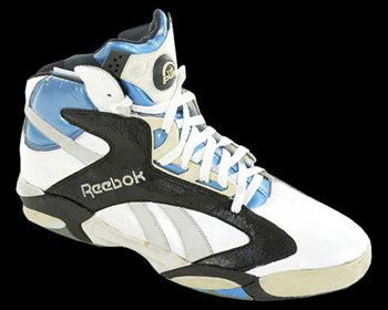 Shaquille O' Neal Game Used Shoe: A mammoth-sized Reebok Pump custom "Shaq" model basketball shoe worn by Shaquille O' Neal during his tenure with the Orlando Magic. Obvious signs of usage around the rubber sole, otherwise fine. Accom