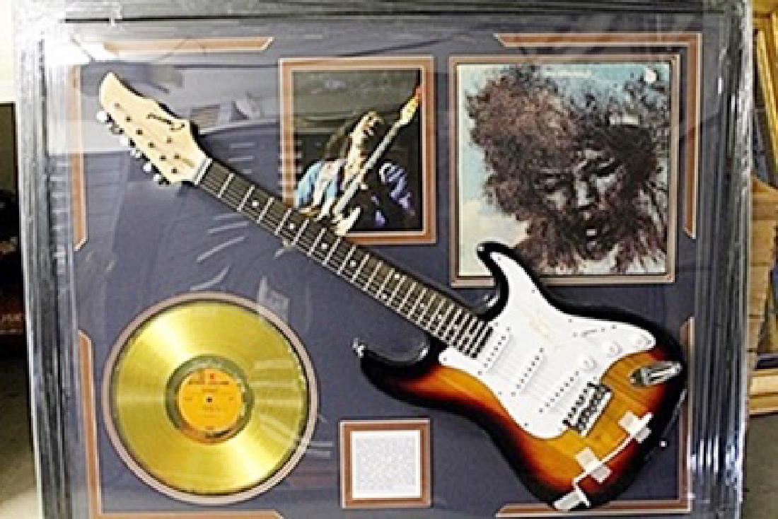 Jimi Hendrix Signed Guitar with Bio, Photo and Gold: Jimi Hendrix Guitar with Laser Matted Autographs. Approx. 35x42in.
