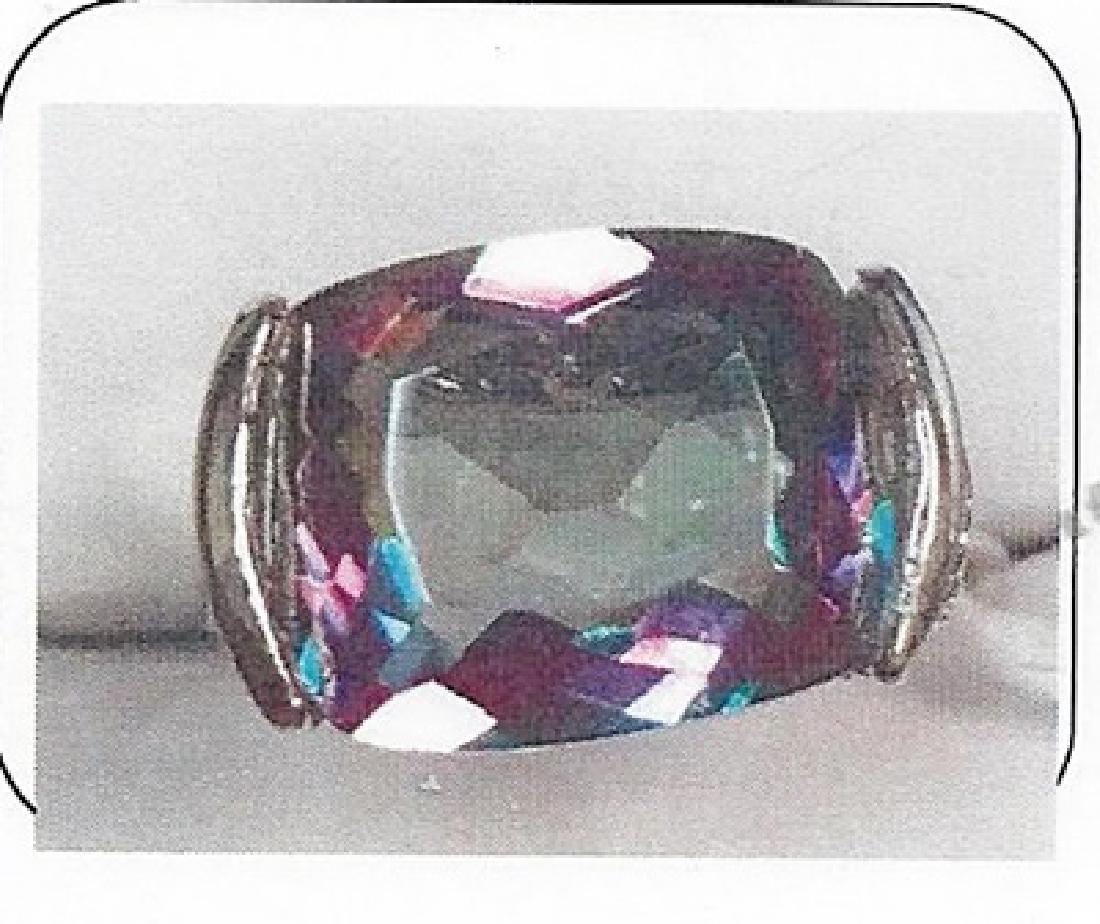 Lady's silver lab alexandrite/diamond ring: This lady silver lab alexandrite/diamond ring is comprised of half bezel set cushion cut lab alexandrite (2.50ctw) and 4 prongs set 02diamonds .01ctw. Total weight of the diamonds are .01ctw the total