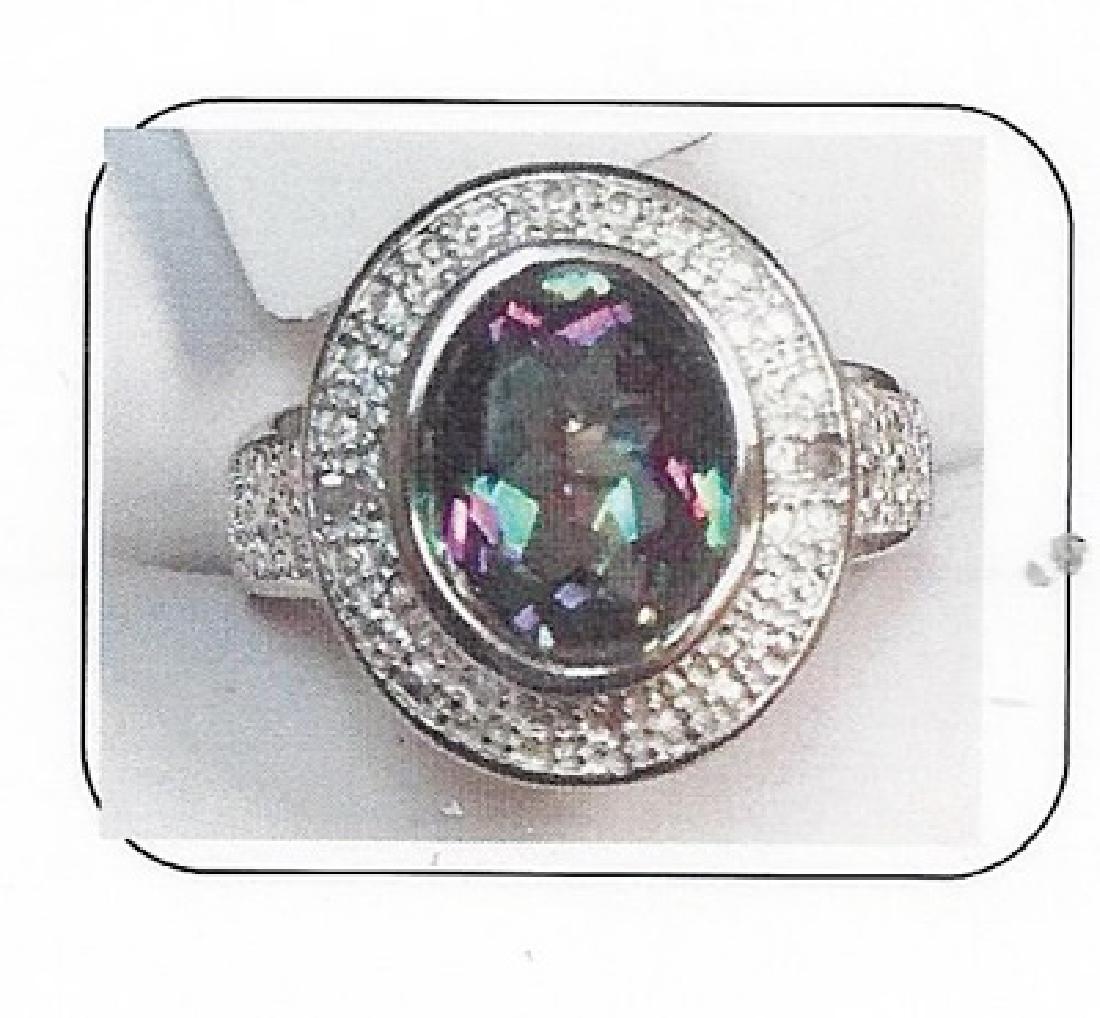 Lady's silver lab alexandrite/diamond ring: This lady silver lab alexandrite/diamond ring is comprised of 4 prongs set oval cut lab alexandrite (1.30ctw) and 4 prongs set 02diamonds .01ctw. Total weight of the diamonds are .01ctw the total weig