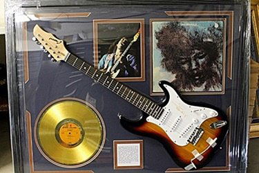 Jimi Hendrix Signed Guitar with Bio, Photo and Gold: Jimi Hendrix Guitar with Laser Matted Autographs. Approx. 35x42in.