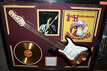 Jimi Hendrix Clapton Signed Guitar & Memorabilia: Guitar with Laser Matted Autograph. Each Item is Made one of a kind in the US to order and may vary slightly from image.