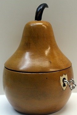 Hand Carved Antique Wood Pear Lockbox w/ Key: Hand Carved, Antique Wood, Pear Shaped, Lockbox with Skeleton Key, Gilded metalwork hinges, and mechanically working Lock, Size Approx. 5 1/2" x 3 1/2" x 3 1/2" in.