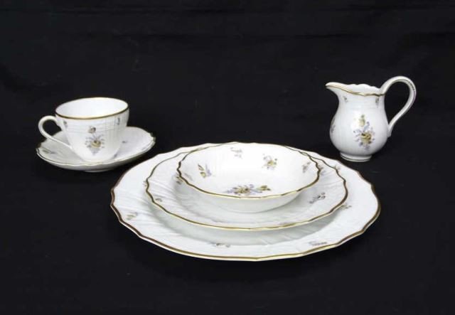 27 Piece Hutschenreuther Bavarian Porcelain: Saxony Pattern. Comprising of 5 dinner plate, 5 salad plates, 7 cups and saucers, 2 bowls and a creamer.