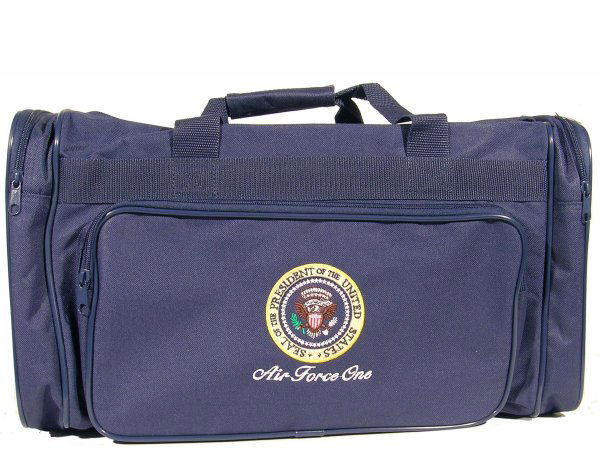 Air Force One Travel Bag Presidential Seal White: Air Force One Presidential Seal travel bag, issued only in 2000, measuring approximately 19.5'' x 11''. Contemporary dark blue canvas bag with zipper pockets. Handsome Presidential Seal and ''Air Forc
