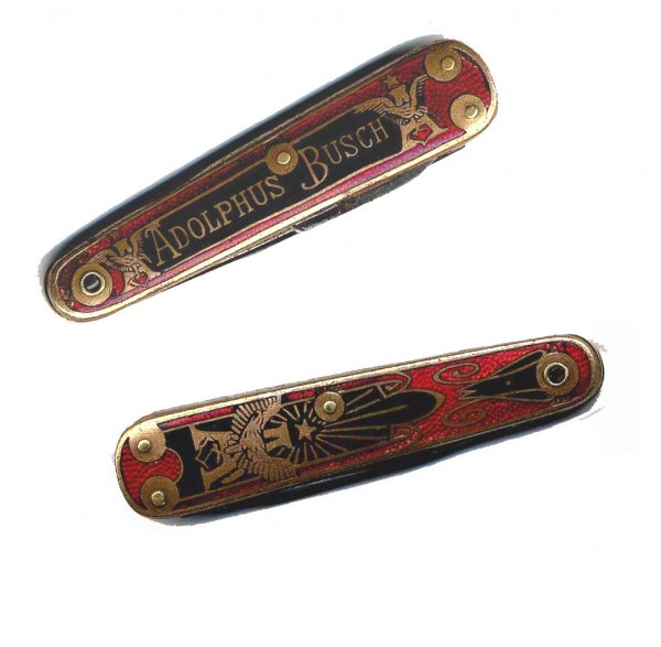Adolphus Anheuser Busch Pocket Knife Beer Kastor: Adolphus Busch enameled pocket knife. Red with gilt outline and text. Face features two gold Anheuser-Busch trademarked logos beside text ''Adolphus Busch.'' Verso decorated with Anheuser-Busch logo s