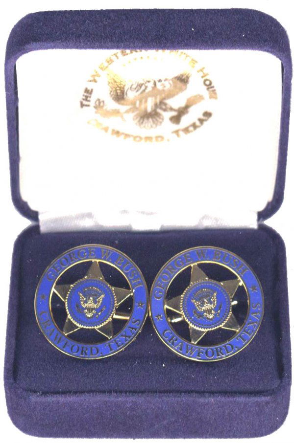George W. Bush Official Western White House Cuffl: George W. Bush official Western White House cufflinks. Presented to guests at a Crawford Ranch fundraiser, cufflinks measure approximately 1'' in diameter. Gold and cobalt blue outer band engraved ''G