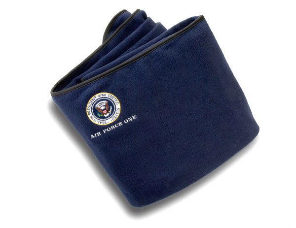 Presidential Seal Blanket Air Force One: Air Force One Presidential Seal blanket, circa 1988 given by then President George W. Bush to visiting guests and supporters. Navy blue fleece blanket with color Presidential Seal and ebony trim measu