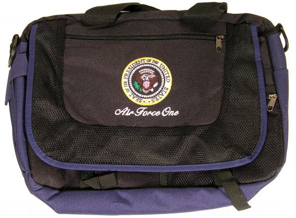 Air Force One Computer Bag Presidential Seal: Air Force One Presidential Seal computer bag, circa 2000, measuring approximately 12.5'' x 17''. Contemporary navy blue combination canvas and mesh bag with zipper pockets and side buckles. Handsome P