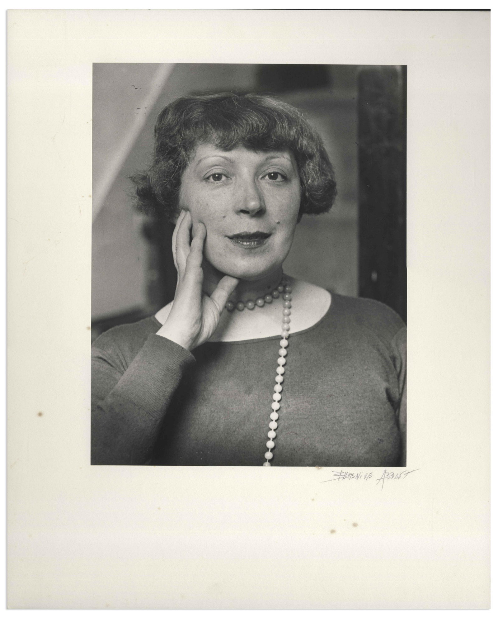 Berenice Abbott Signed 16x20 of Marie Laurencin: Berenice Abbott silver gelatin print of French artist Marie Laurencin, one of Abbott's earliest portrait photographs from 1926 while in Paris. Glossy photo measures 10.25'' x 13.25'', mounted to 16'' 