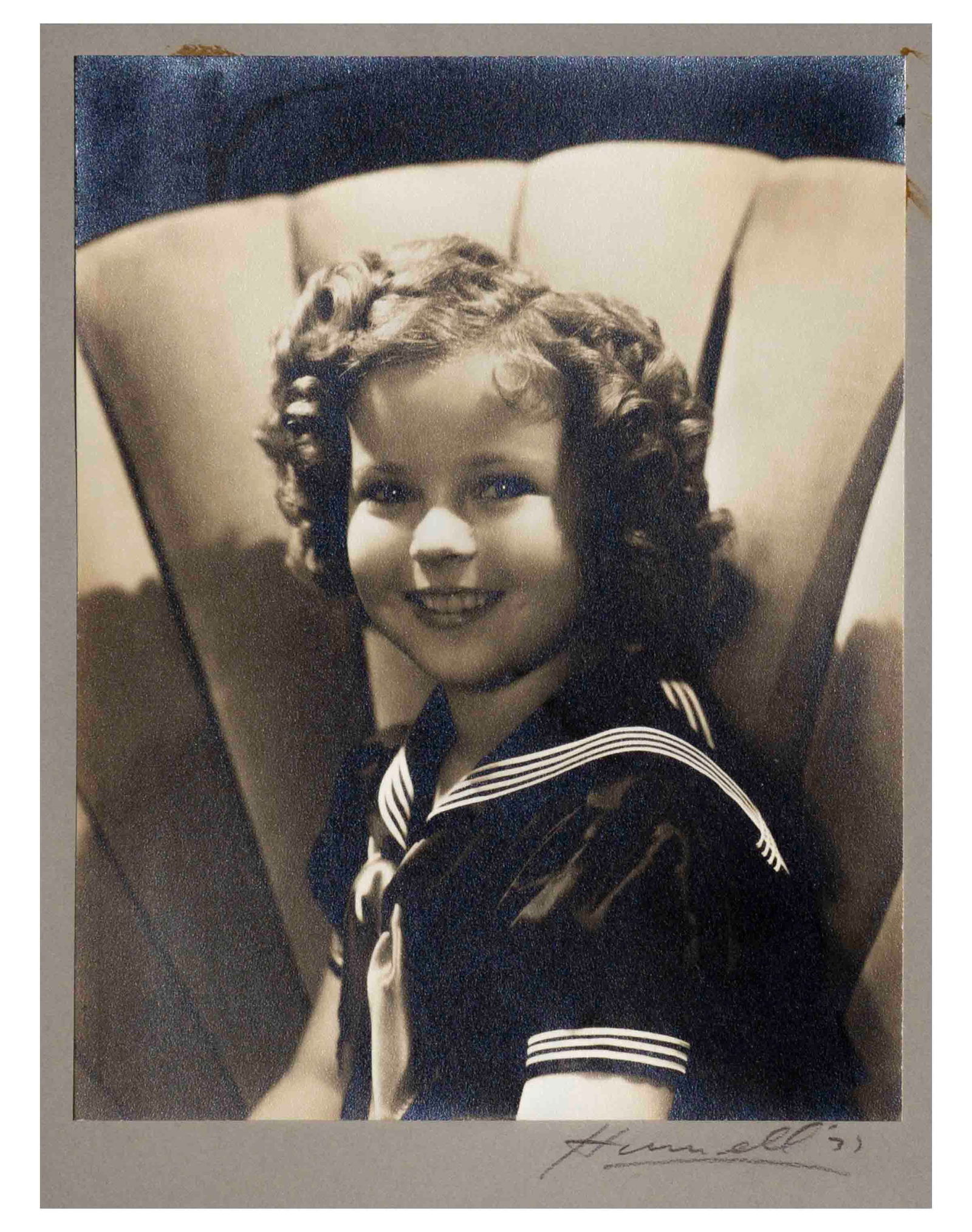George Hurrell Signed Shirley Temple Heidi Photograph: Large portrait photo of Shirley Temple taken by famed Hollywood photographer George Hurrell during the filming of ''Heidi'', personally owned by Shirley and signed by Hurrell on mat. Matte photo measu