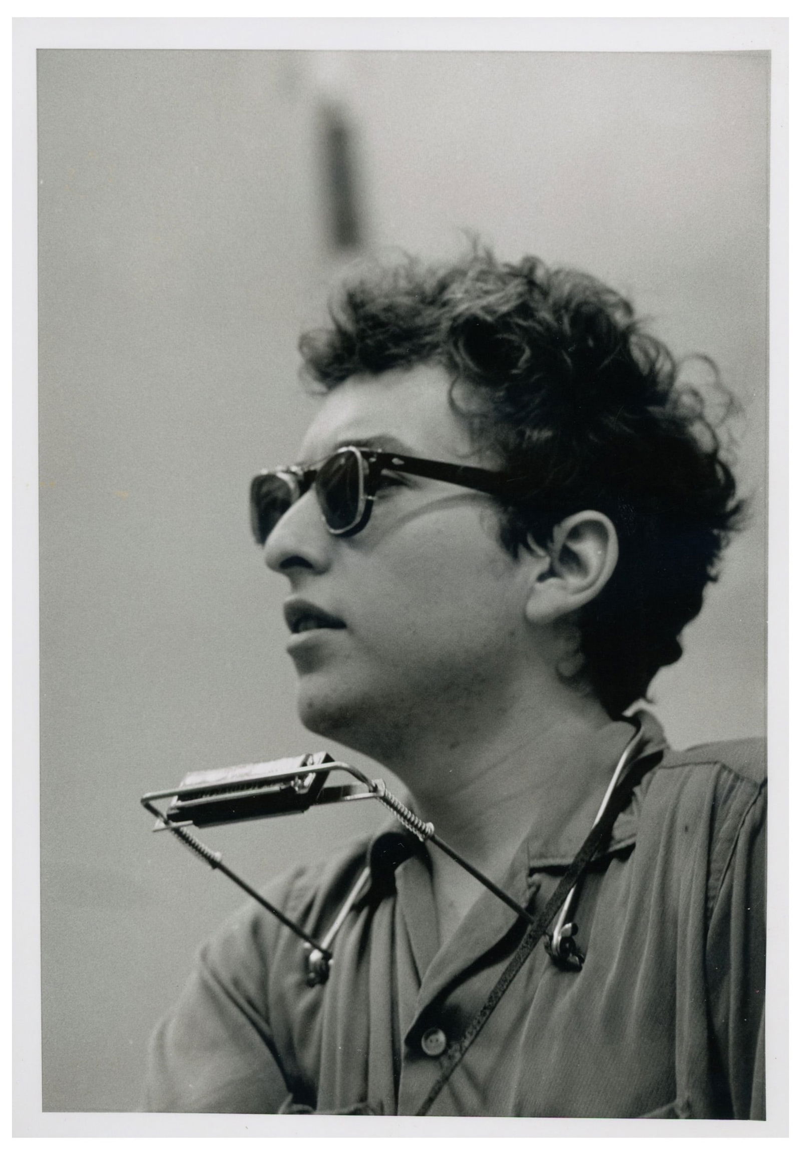 Bob Dilan Photograph by Joe Alper: Photograph of a young Bob Dylan from 1962, taken by photographer Joe Alper who captured Dylan in the early 1960s when he was a working folk musician playing Greenwich Village clubs. Glossy silver gela
