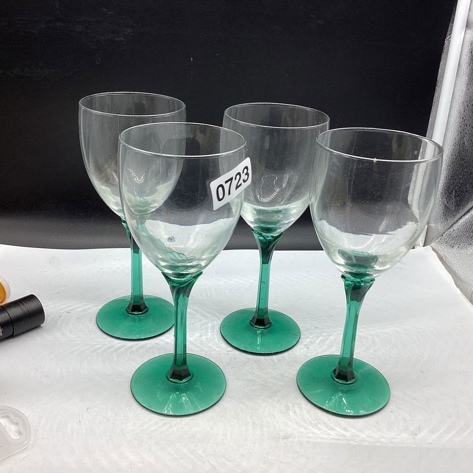 4 CLEAR W/GREEN STEMS WINE GOBLETS: 8" TALL GOOD SHAPE
