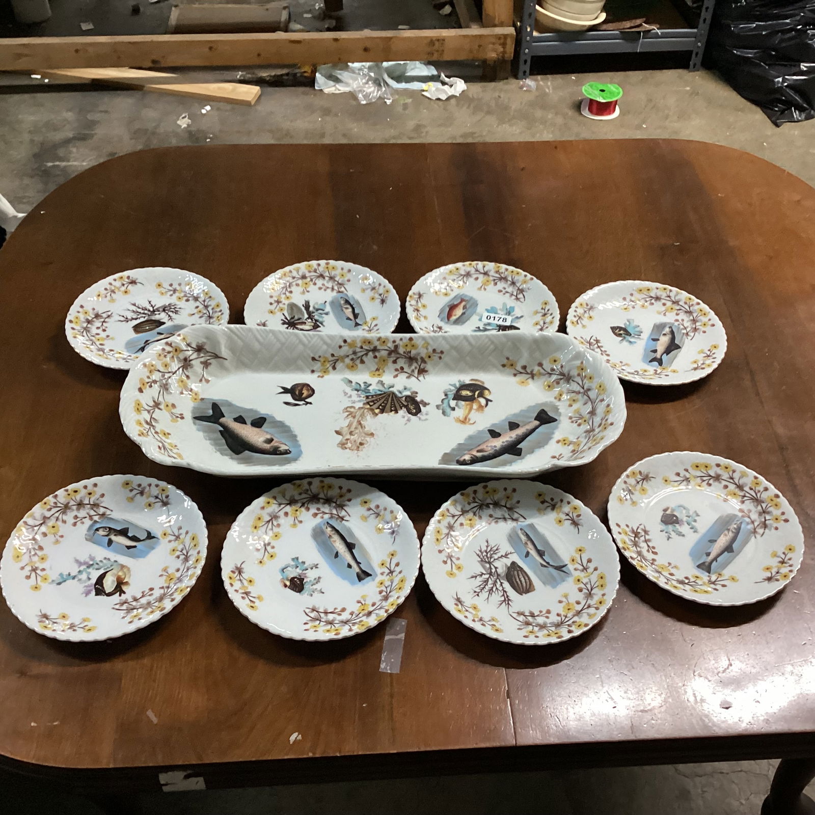 9 PC. PORCELIAN HAND PAINTED FISH SET: PLATTER 23" W PLATES 7 3/4" W GOOD SHAPE