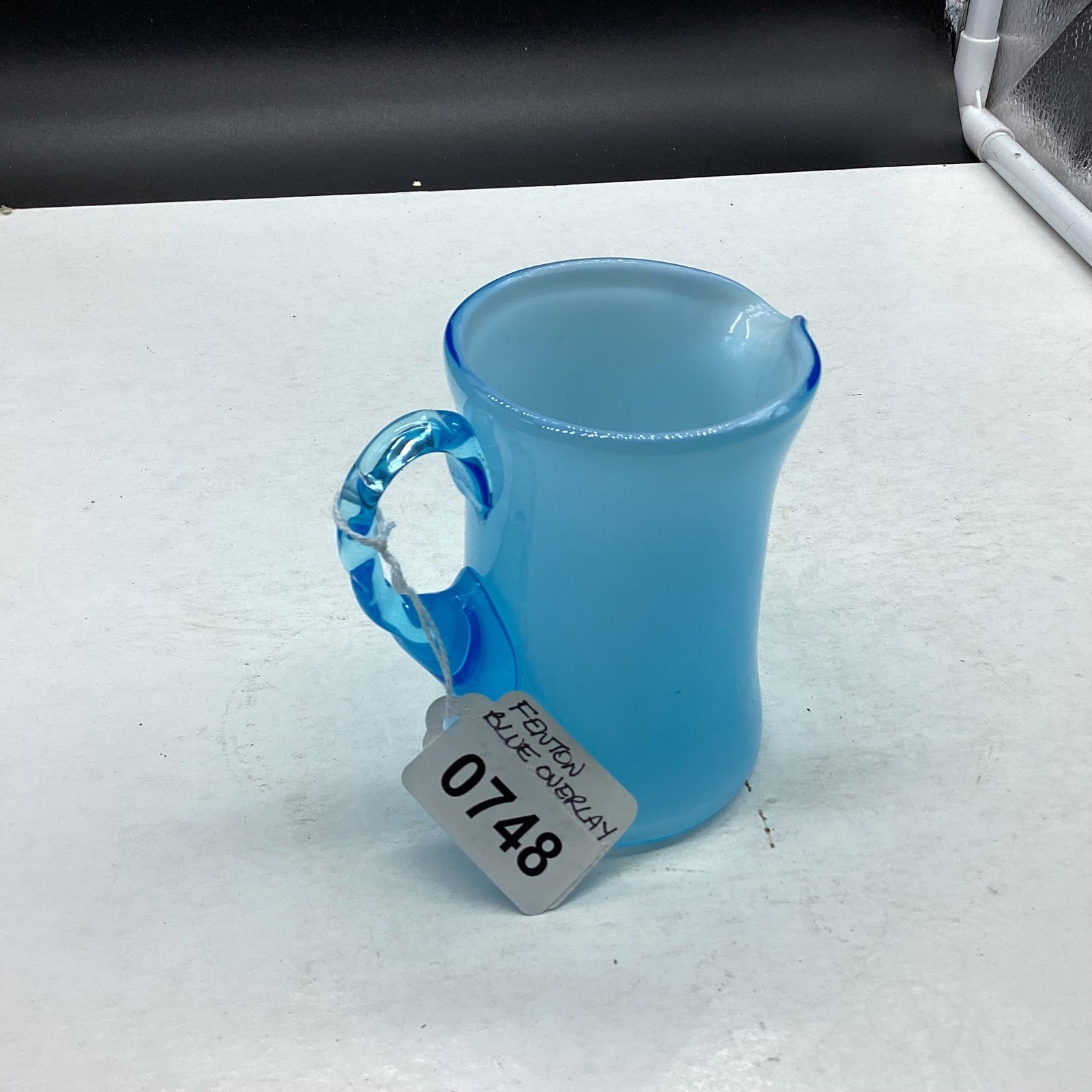 FENTON BLUE OVERLAY PITCHER: 3 3/4 TALL GOOD SHAPE