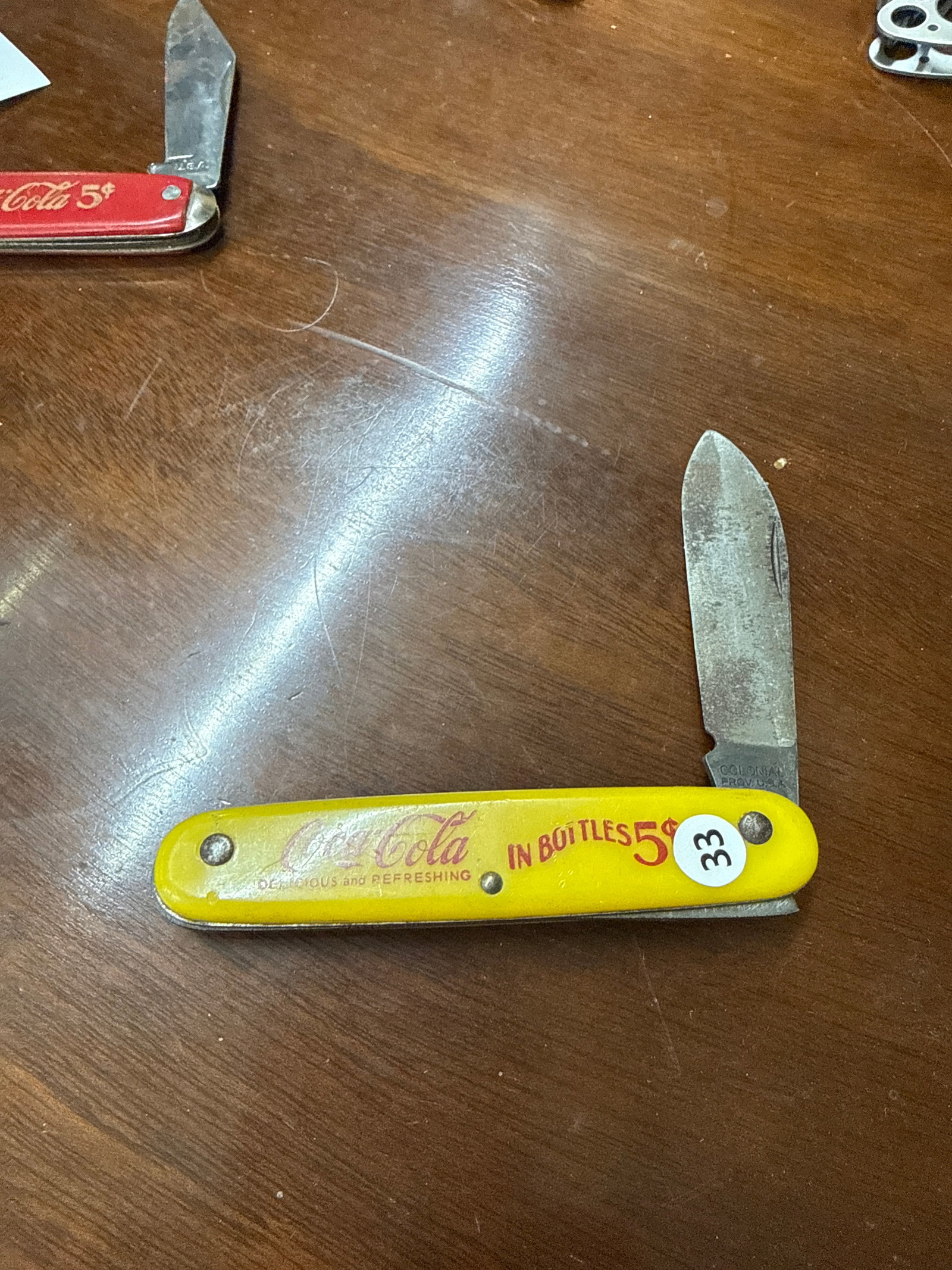Colonial coca cola knife some tarnish: Great color