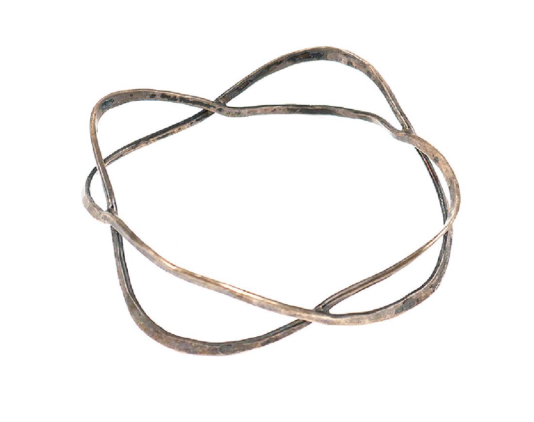 Sterling Silver Hammered Bracelet poss Ed Wiener: Sterling silver bangle bracelet, handmade in the manner of Wiener (from the same estate as another Wiener piece). Measures 3/4" wide. Inside signed Sterling.