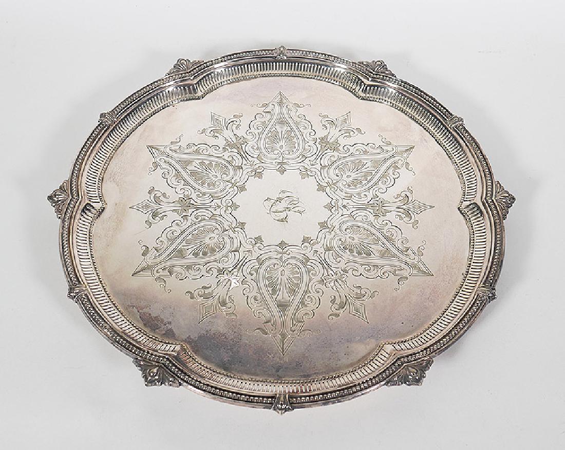 19C Mappin & Webb Sheffield Silver Salver Tray: Fine English silverplated tray by Mappin & Webb, with pierced frame and ornate, hand-chased designs around fancy script monogram (undetermined letters). Measures about 15" in diameter.