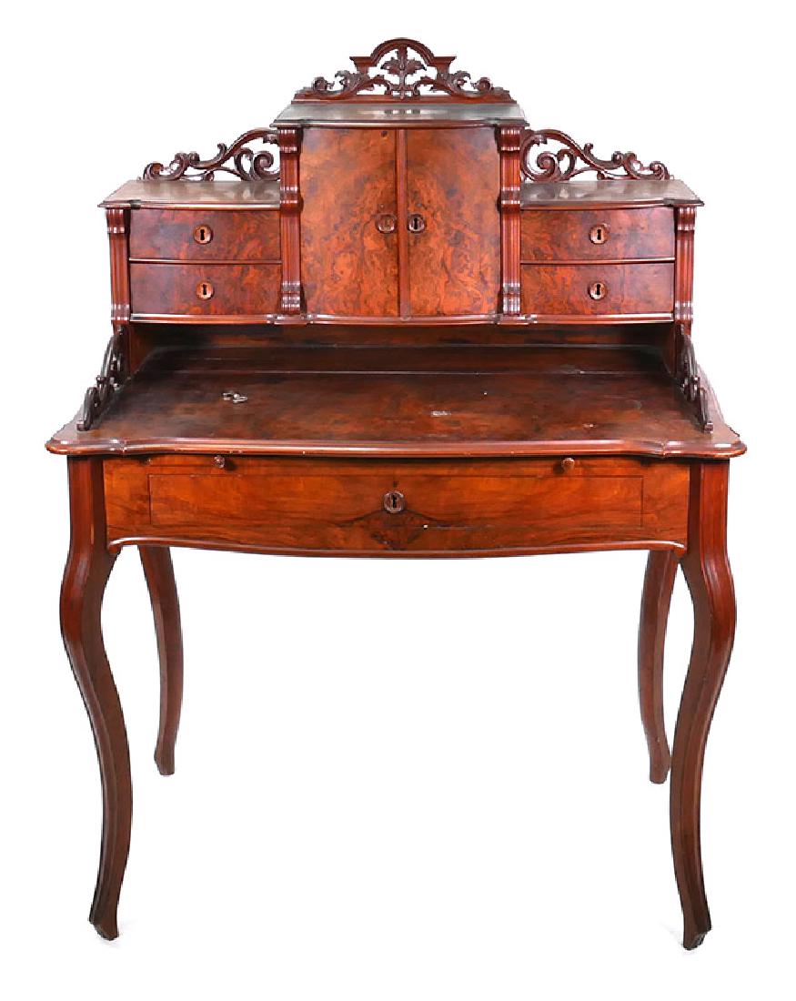 Antique Burl Walnut Ladies Writing Desk: Measures 51" high, 37-1/2" wide. Good condition with some typical wear, including some fixable veneer flaking. Carved adornments, cabriole legs. Four drawers and center cabinet. Slide-out tray.