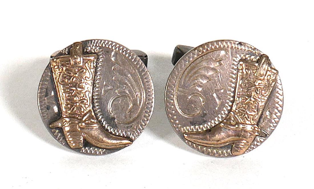 Cowboy Boots 10k Gold & Sterling Silver Cufflinks: Vintage circa 1930s Mexican sterling silver and 10k gold cufflinks, signed AHS on the lock bar and AS Hernan on the back. Pair depicts mirror image of gold cowboy boot on engraved silver background. M