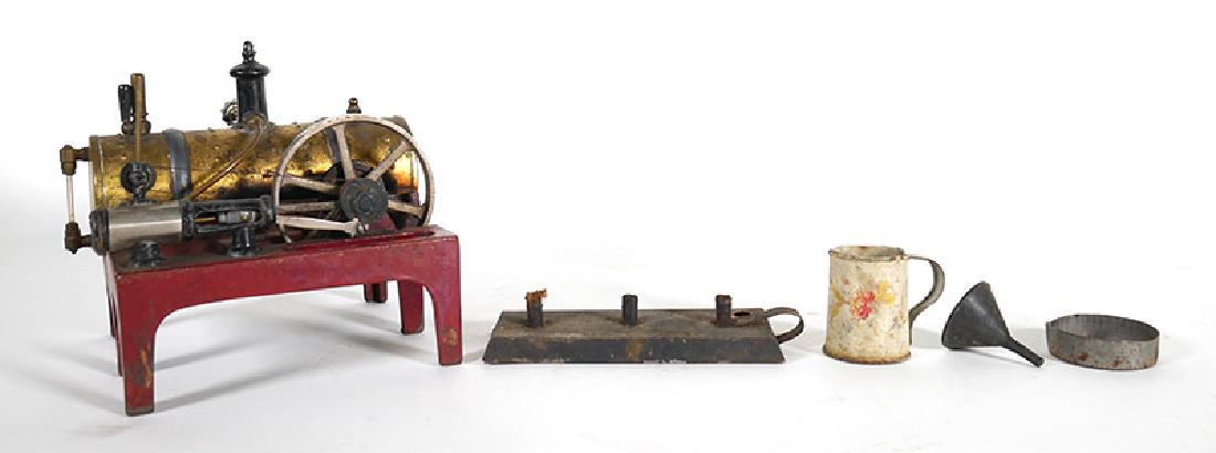 Weeden Cast Iron and Brass Steam Engine: Good condition. Includes original three-wick burner and “Railway Express Agency” shipping box, which may be original to the piece. Measures 6” high x 7” long.