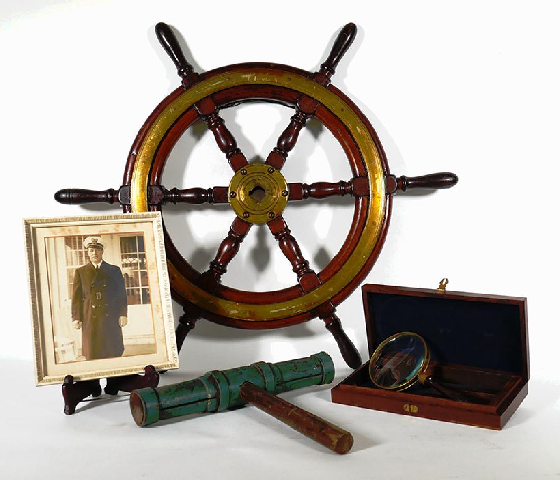 Maritime Antiques from Ship Captain's Collection: A wood and brass ship's wheel, cased map magnifying glass and shipwright's caulking mallet, as well as a photograph of the captain of the Fire Island Belle, a ferry that operated out of Long Island be