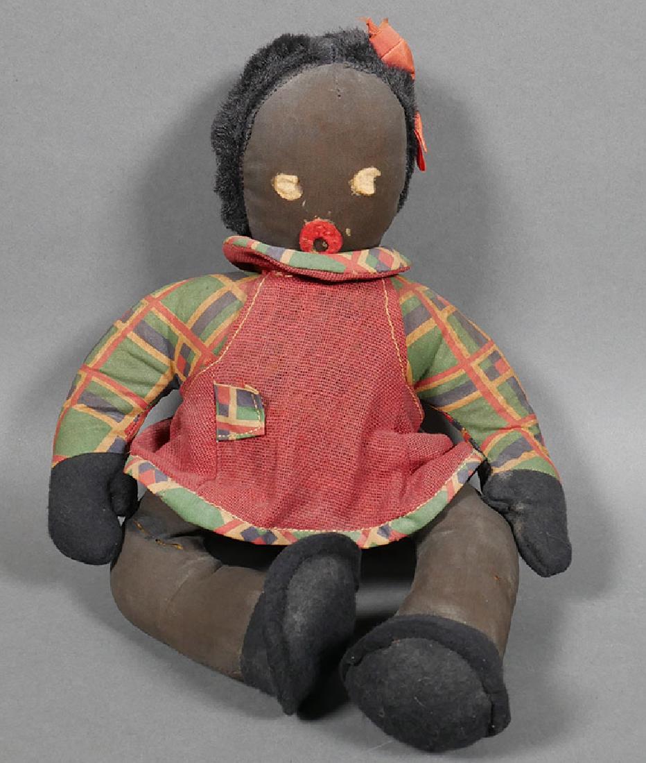 Vintage 1930s Black Americana Cloth Toy Girl Doll: Circa 1930s baby doll in original clothing. From old doll collection. Fine fabric with felt hands and feet, and felt eyes and mouth. Default pose is seated, but measures 10-1/2" high in standing posit