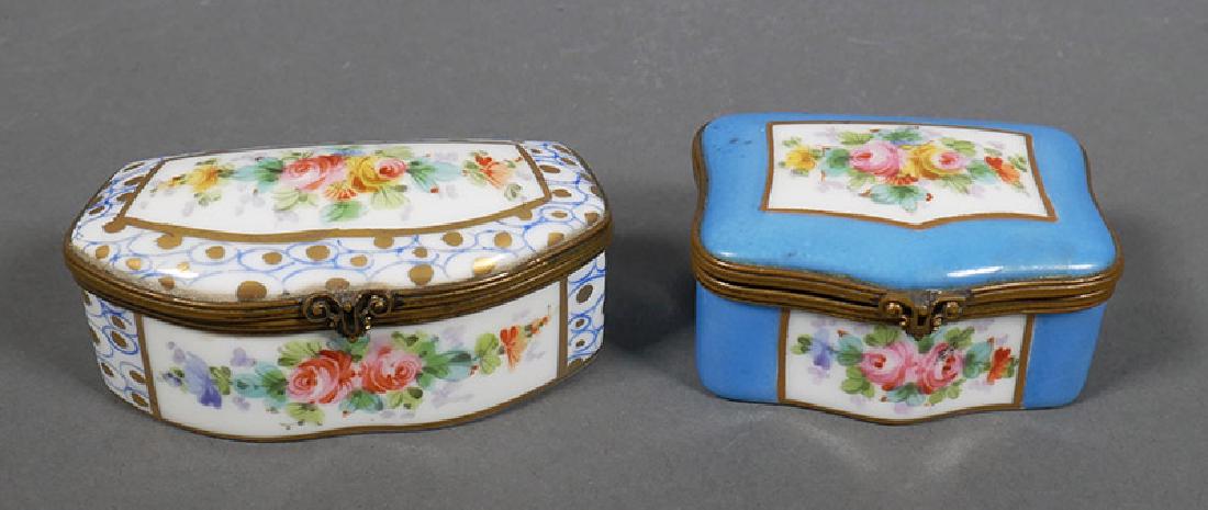 Two Hand Painted Sevres Porcelain Ormolu Boxes: Two signed Sevres French porcelain boxes. Wider box measures 2-7/8" wide. Both in excellent condition.