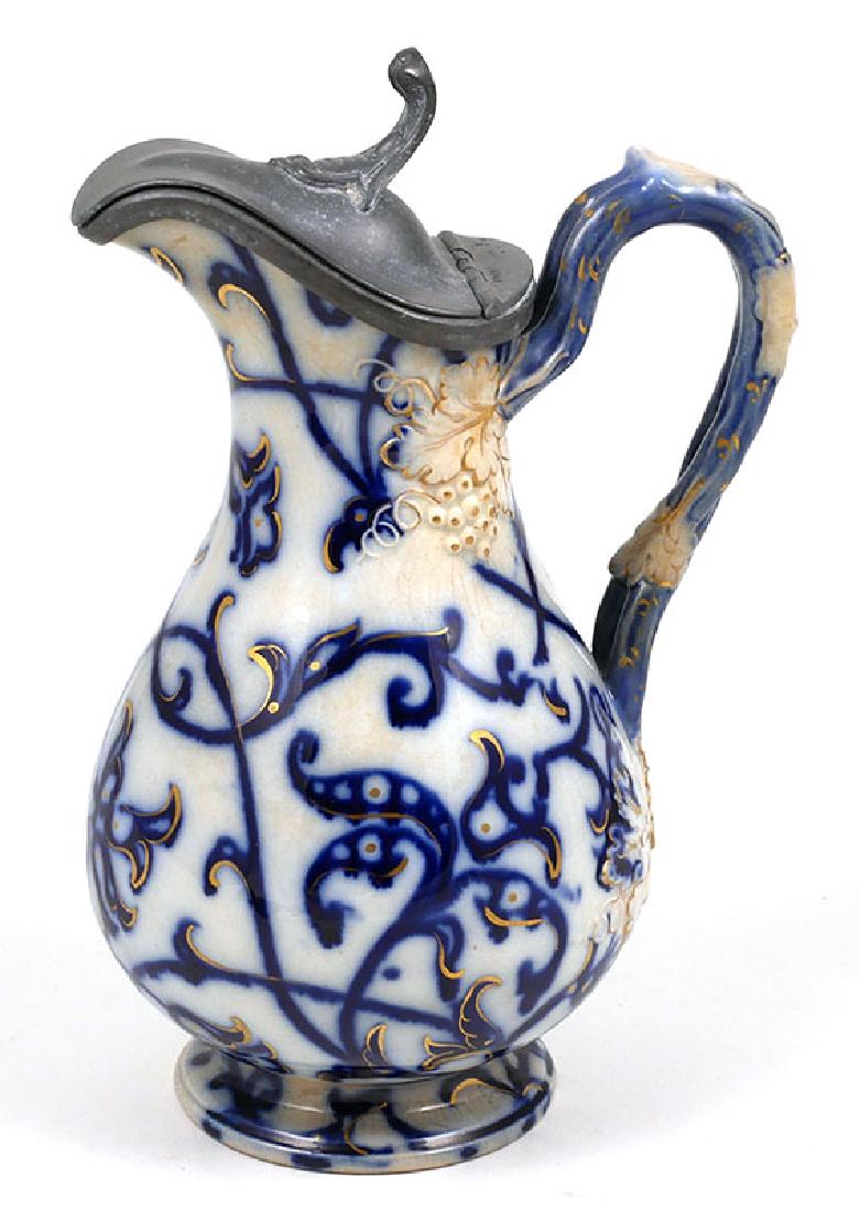 Flow Blue Grape Motif Syrup Decanter Jug: Very scarce 1870s English ironstone piece. Measures 8" high. Excellent condition.