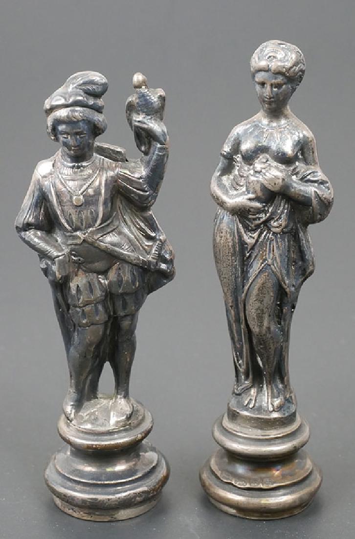 Two Antique British Sterling Silver Chess Pieces: Man and woman figures, each made in hollow sterling silver, London hallmarked with maker MF and dated 1900. Pieces measure 3-3/4" and 4" high. Not sure if they were originally chess pieces, but given 