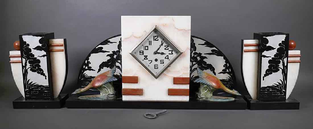 Art Deco Period Marble Mantel Clock w/Garniture: Art Deco era mantel clock, flanked with birds in front of intaglio panels. Might work, but missing pendulum. Excellent condition overall. Main clock measures 20-3/8" wide and 10-1/4" high.