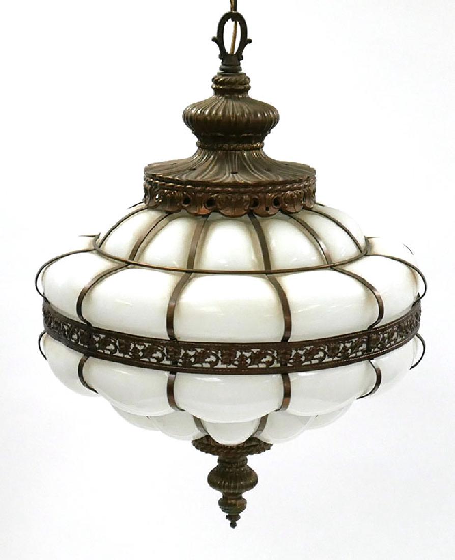 Vintage Sanctuary Milk Glass Hanging Lamp: Vintage milk glass hanging pendant lamp with ornate caging, likely hung in a sanctuary. Mint condition. Measures 16" high.