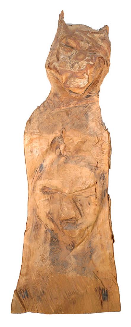 Jesse Aaron Totem Florida Folk Art Wood Carving: Carved wood dog (?) with mask totem carved by Jesse Aaron (American, 1887-1979). Measures about 25" long. Born in Lake City, Florida, Aaron was part African American and part Seminole Indian. He spent