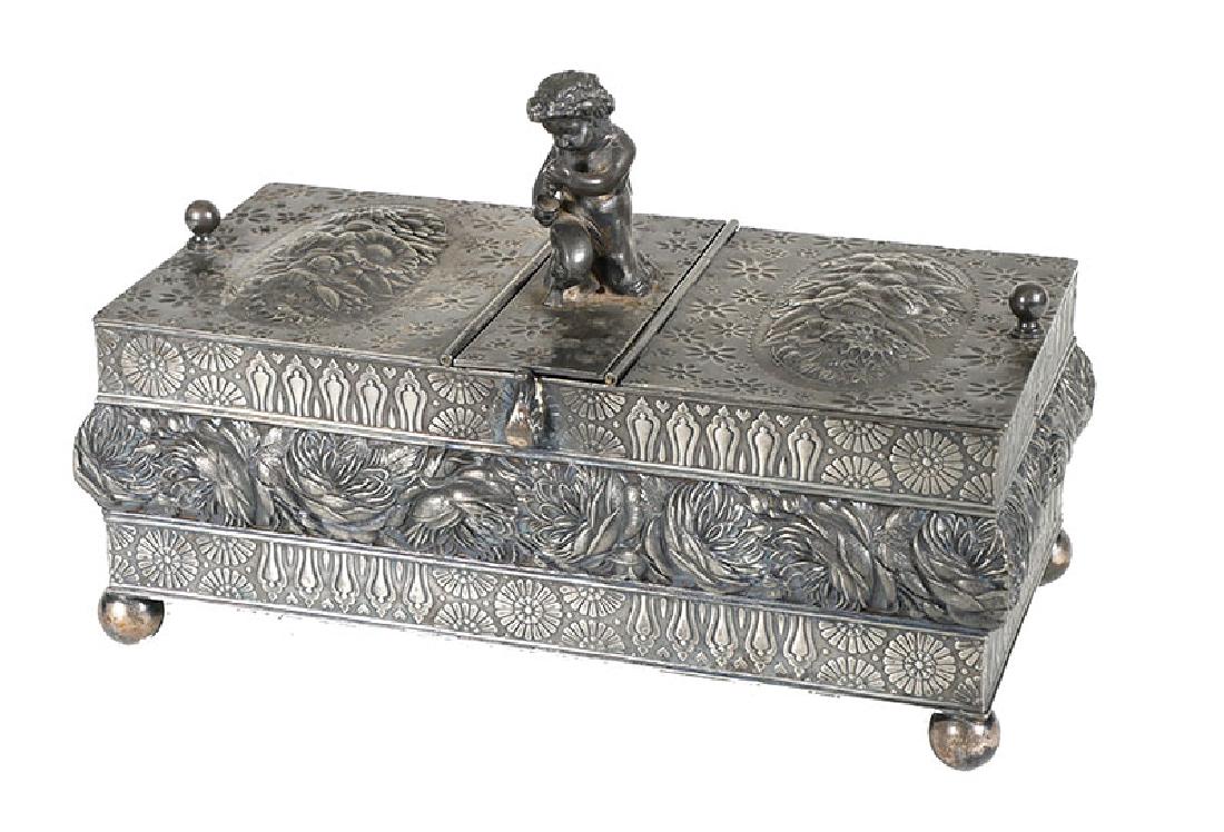 1890 Ornate Meriden Silver Cigar Humidor Figural: Magnificent antique Victorian silver plated repousse two-section cigar humidor. Center section is for a sponge or whatever is used for humidity, and it is covered by a panel topped with a young satyr 