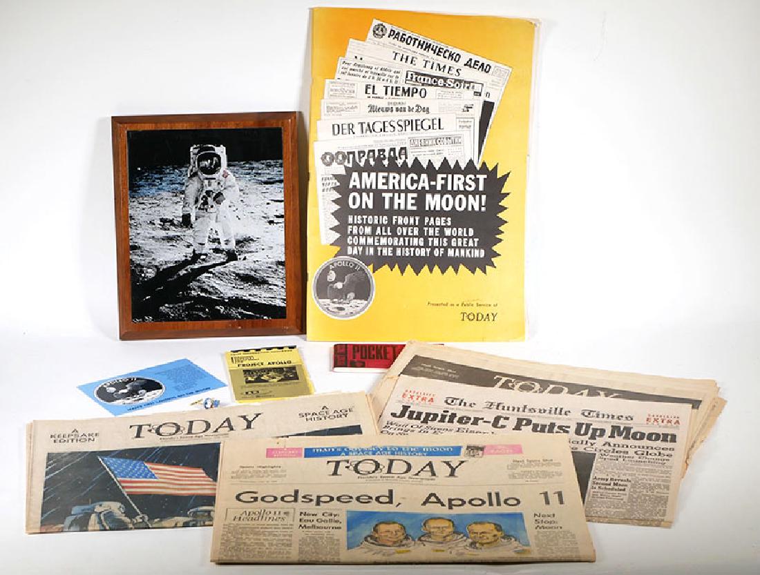NASA Employee's Collection: 1960s Apollo items: From the estate of a NASA employee and associate of Wernher von Braun. Includes metal litho plaque of astronaut on the moon, several newspapers, NASA booklets, and a rare Snoopy Apollo 11 tie tack. Al