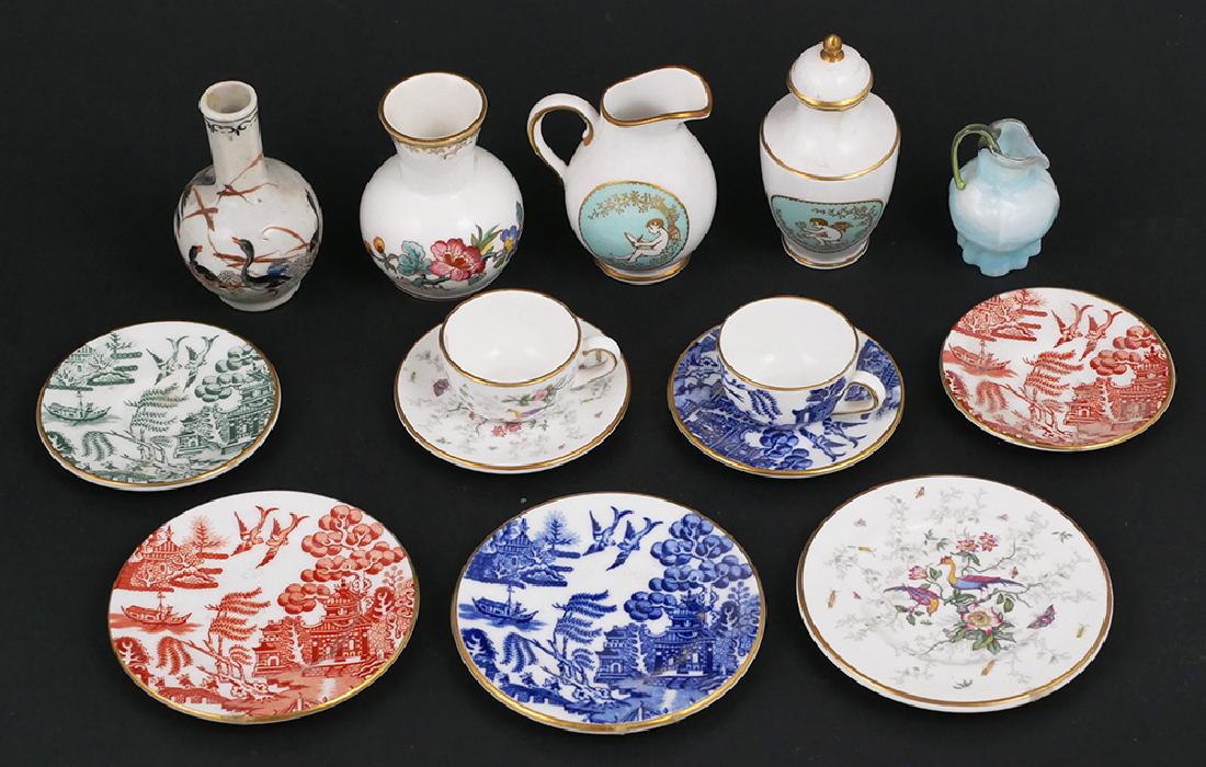 Group of 12 Coalport & Spode Porcelain Miniatures: Group of 12 Coalport and Spode porcelain miniatures including plates, teacups and saucers, pitcher, vases, and one art glass pitcher. Hand painted with gilt accents. All marked on underside. Good cond