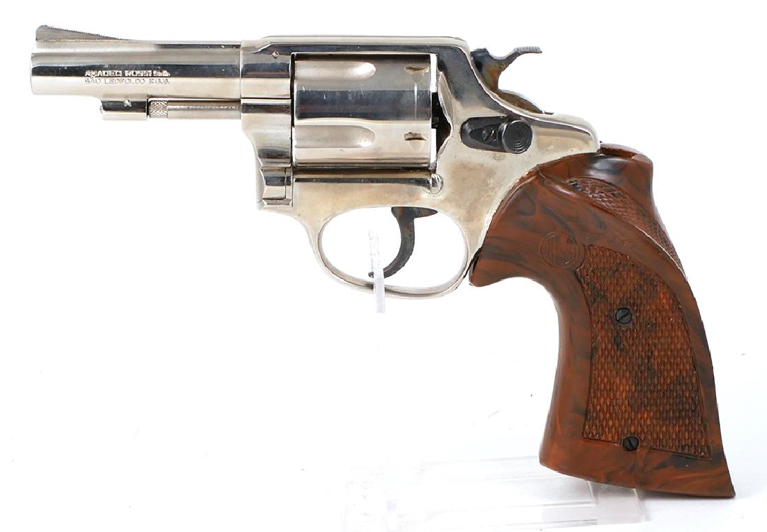 Rossi 5-Shot .38 Spec Revolver Nickel Mod 33: Nickel plated Rossi revolver with contoured target grips, model 33, .38 special, 3 inch barrel. Grips have chip not affecting function. Gun action is tight, no rust. Comes with original box. Please no