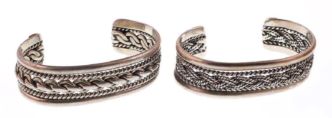 2 Roger Francisco Navajo Sterling Silver Bracelets: Two braided style sterling silver bracelets, each signed RVF, for Navajo jewelry designer Roger Francisco. Each is about 3/4" wide. Total weight 2.6 Troy ounces.