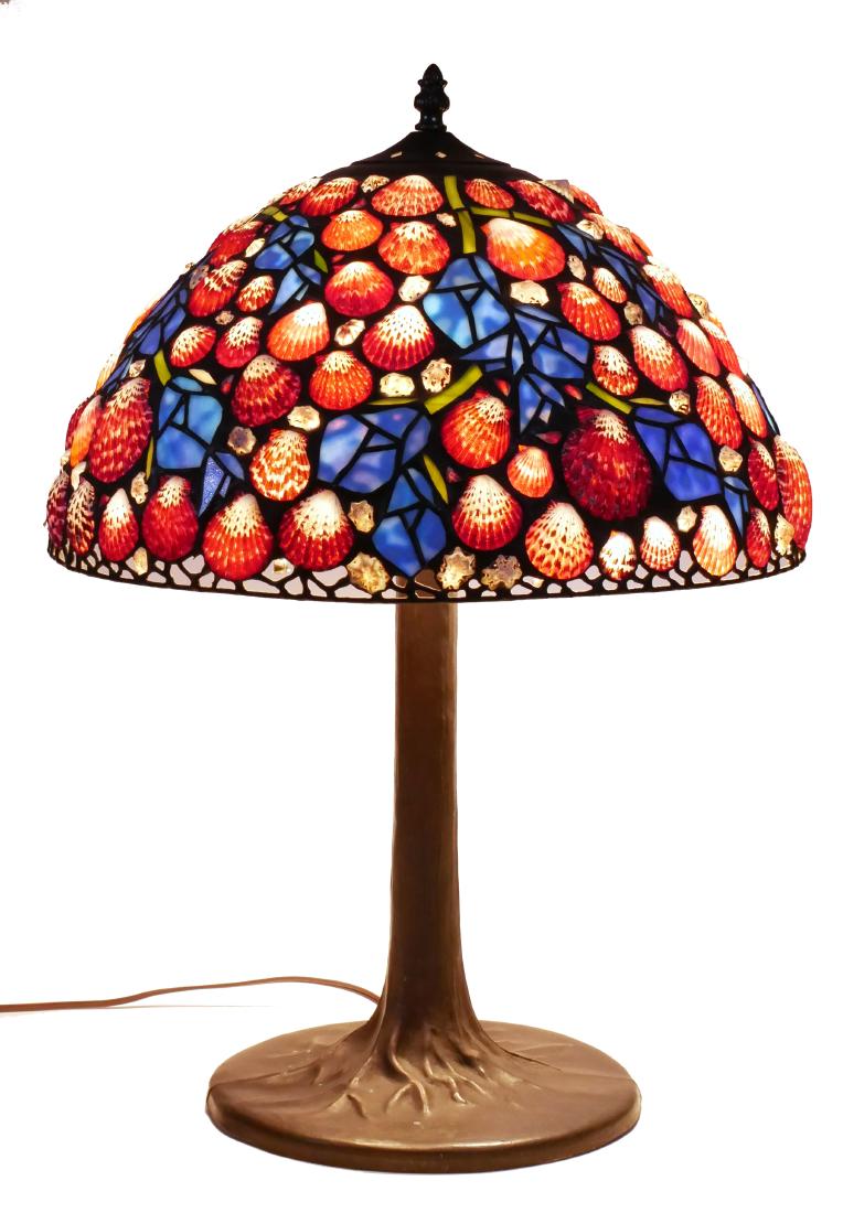 Hoosin Scallop Shell and Flower Table Lamp: Signed Richard Hoosin lamp with scallop shells and blue stained glass flower bud motif. Shade measures 15-3/4" diameter. Lamp about 23" high.